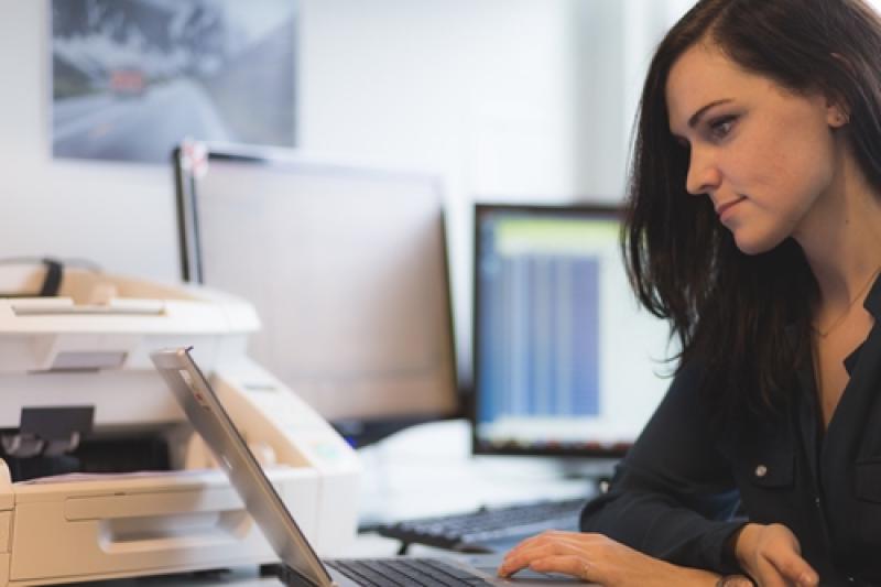 Woman using a laptop at work